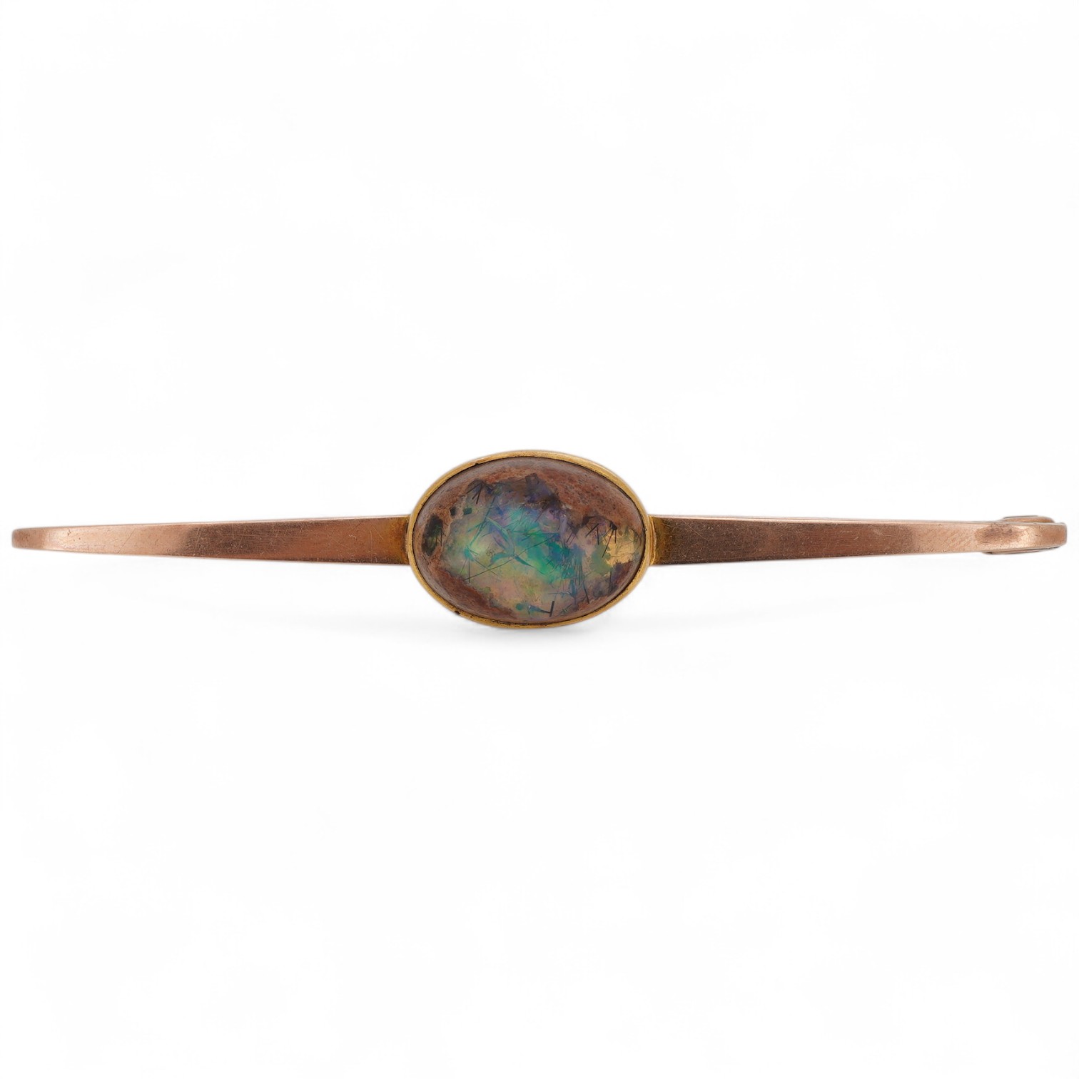 A boulder opal brooch, early 20th century, the bar brooch set with a cabochon boulder opal measuring approximately 16.9 x 12 x 9.5mm, mounted in gold, gross weight 8 grams